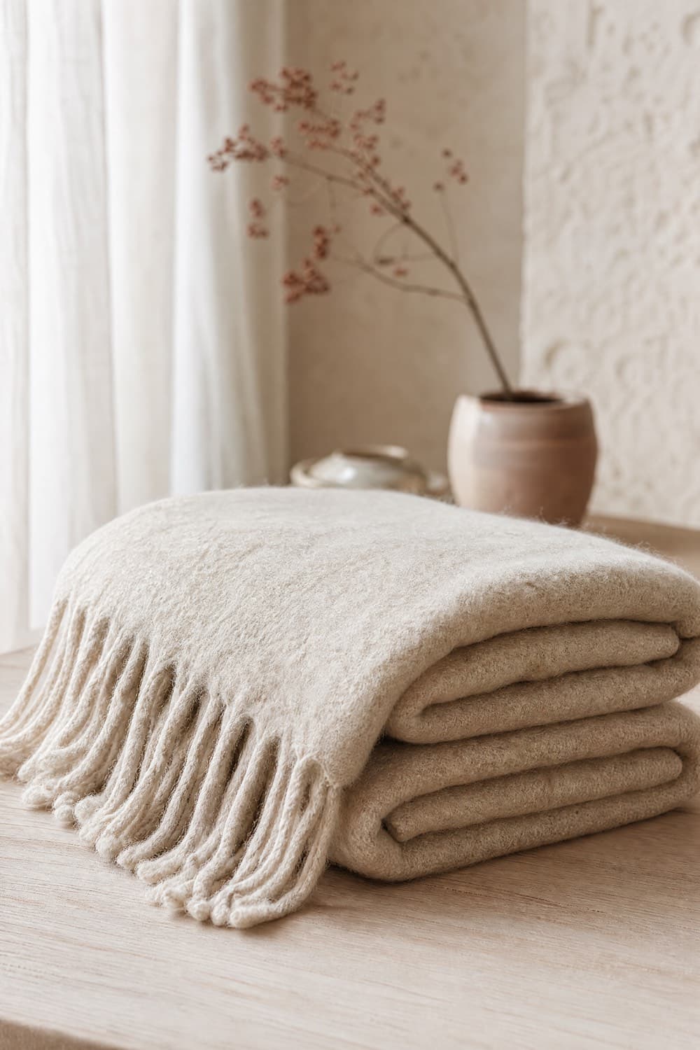 Thick oatmeal wool and cashmere wrap with a fringed edge