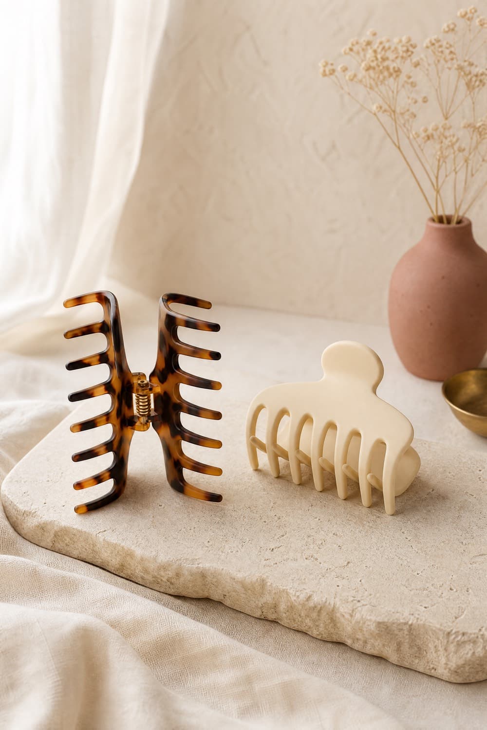 Two large matte claw clips in tortoise and cream tones